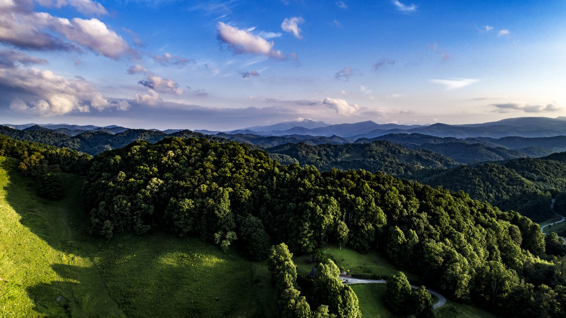 Aerial landscape of a green village and surrounding countryside